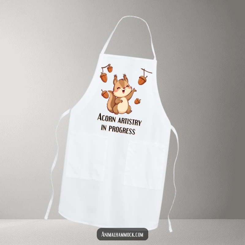Funny squirrel character juggling acorns while suspended, printed on a kitchen apron for a humorous cooking experience.