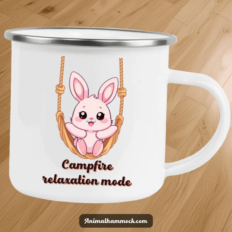 Funny camping mug featuring a fluffy pink bunny with big eyes, joyfully swinging on a rope hammock, perfect for serene mornings.