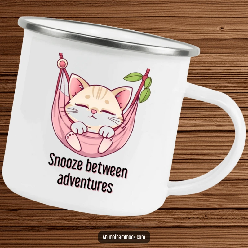 Funny round cat with sparkling eyes napping in a hammock, perfect for this durable and humorous camping mug.