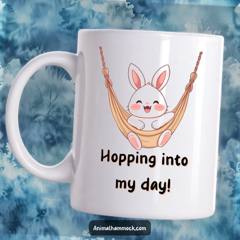 Funny fluffy bunny with rosy cheeks joyfully bouncing in a hammock, depicted on this cheerful mug.