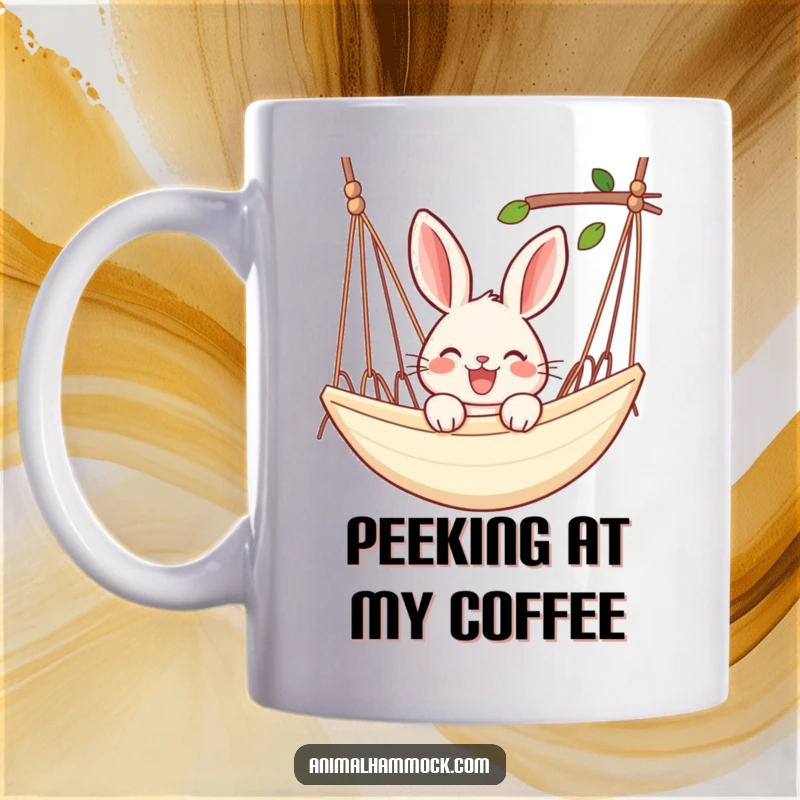 Funny rabbit mug showing a joyful rabbit peeking over the edge of a hammock, embodying relaxation and happiness.