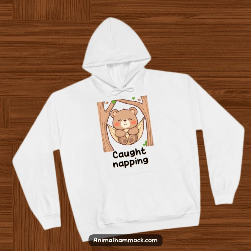 Funny bear hoodie showing a happy bear snuggled in a hammock, eyes closed, ideal for cozy and humorous relaxation.