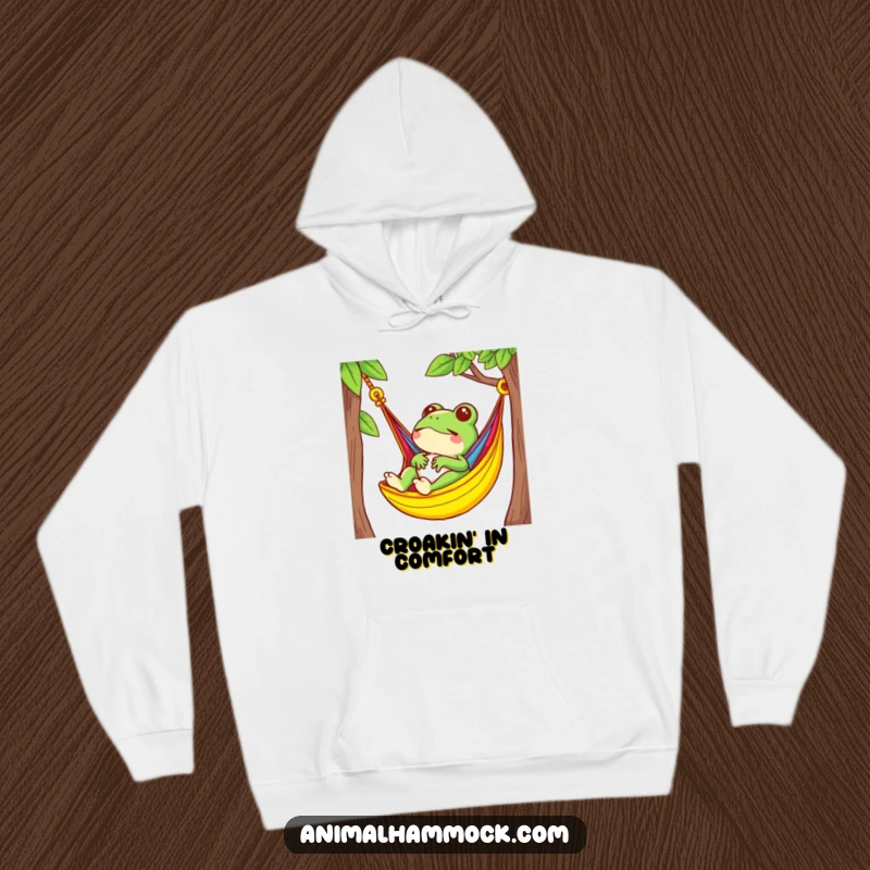 Funny frog character serenely relaxing in a brightly colored hammock, designed for a cozy and humorous hoodie.