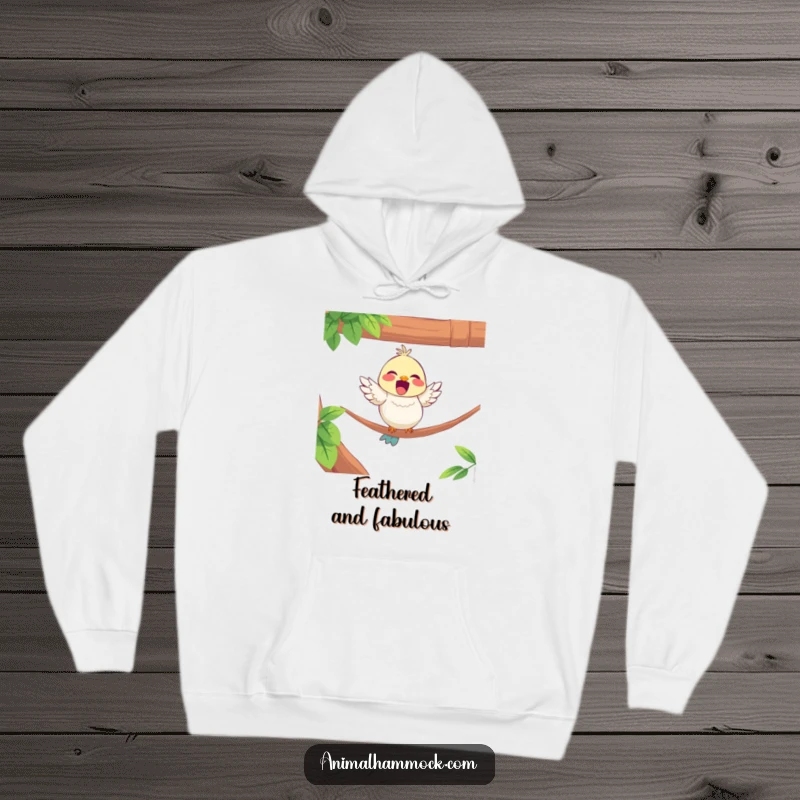 Funny hoodie featuring a delighted bird character perching on the edge of a hammock, perfect for cozy observation.