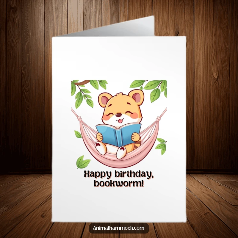 Funny Free Printable Birthday Card: A happy animal engrossed in reading a book while lounging comfortably in a swaying hammock.