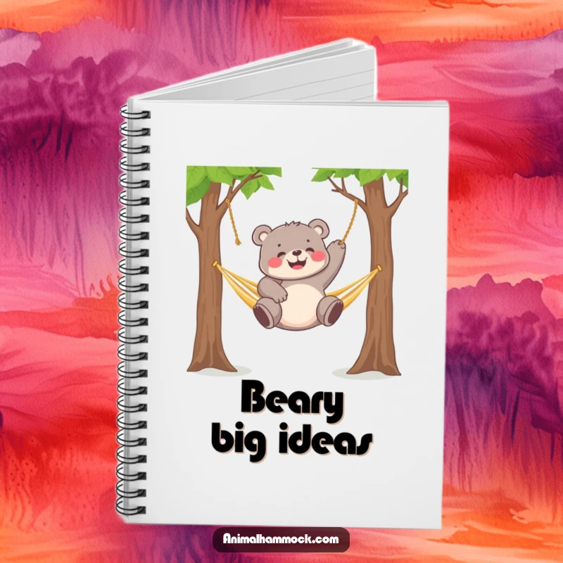 Funny chubby bear cub gleefully dangling from a hammock strung between two trees, featured on this notebook.