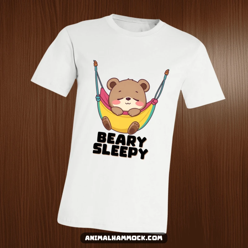 Funny Bear Cub T-Shirt depicting a smiling cub blissfully fast asleep in a colorful hammock, showcasing ultimate relaxation and cuteness.