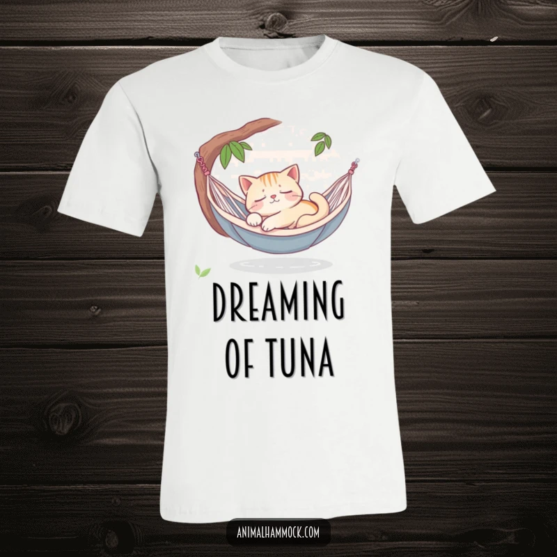 Funny sleepy cat dreaming peacefully in a hammock oasis, printed on a soft t-shirt, embodying ultimate relaxation and serene bliss.