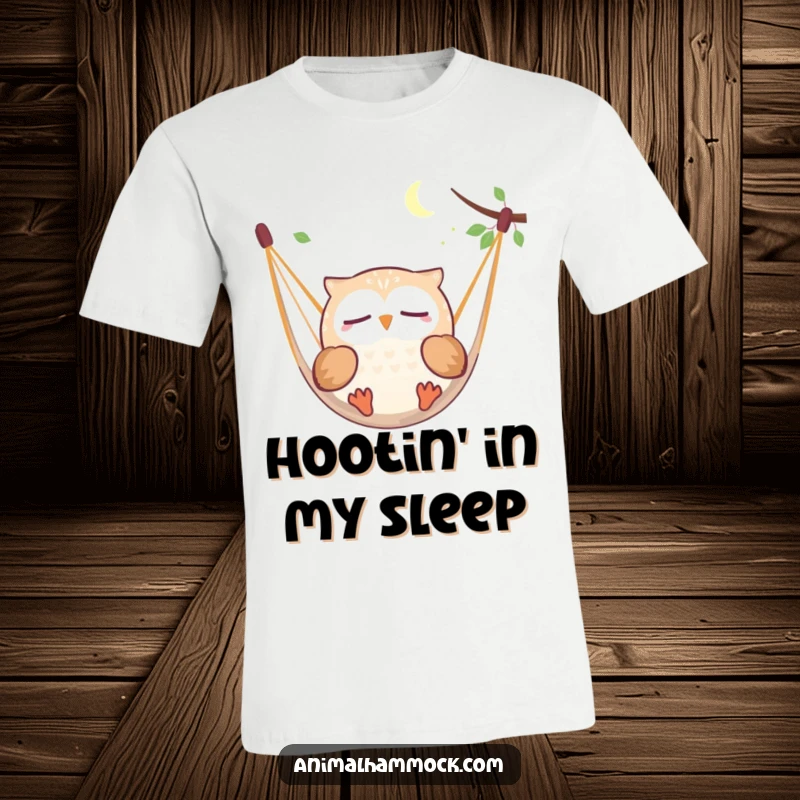Funny, round owl happily dreaming and floating in a soft hammock, perfect for a comfortable and humorous t-shirt.