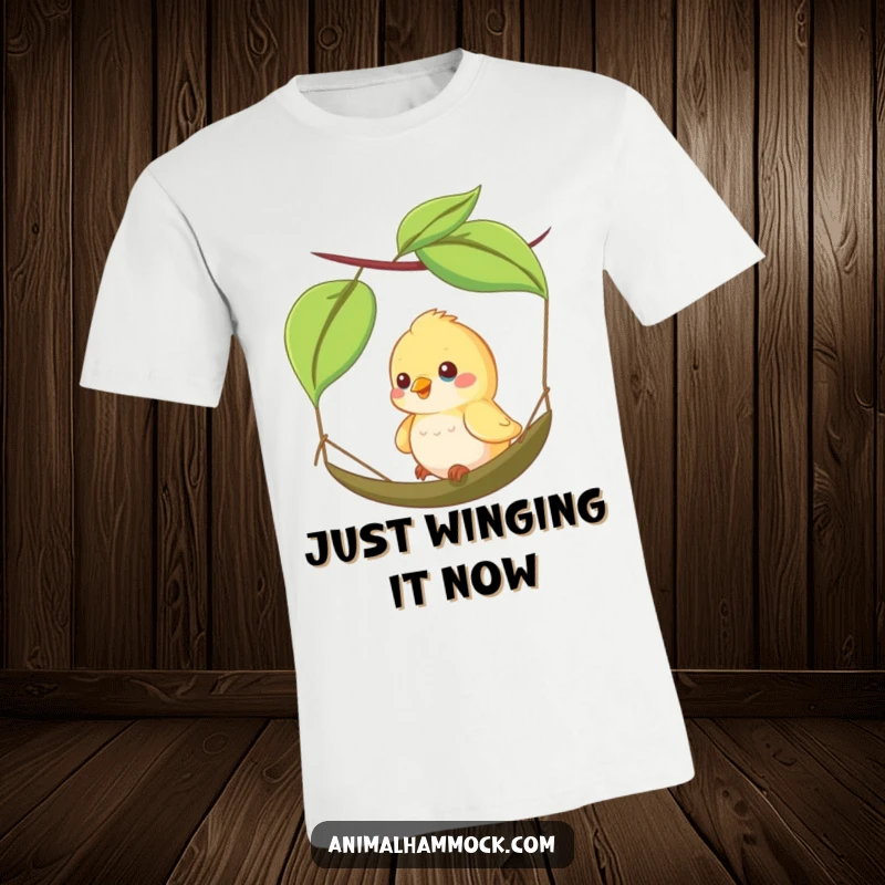 Funny t-shirt showing a happy bird mid-swing on a small leaf hammock, capturing a moment of aerial joy and freedom.