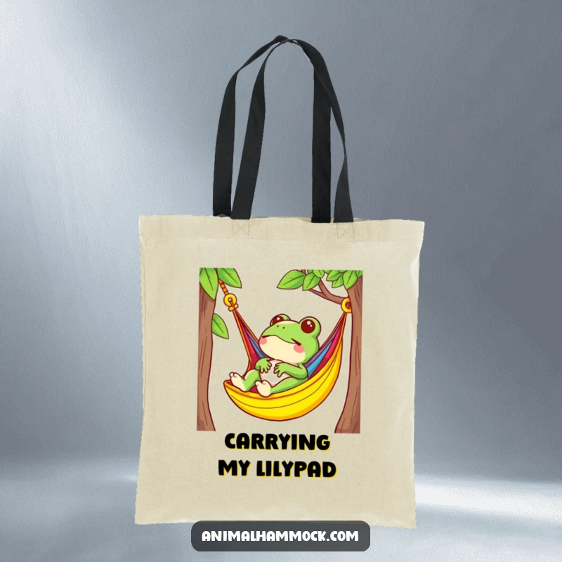 Funny small frog character relaxing in a brightly colored hammock, featured on a stylish tote bag for everyday use.