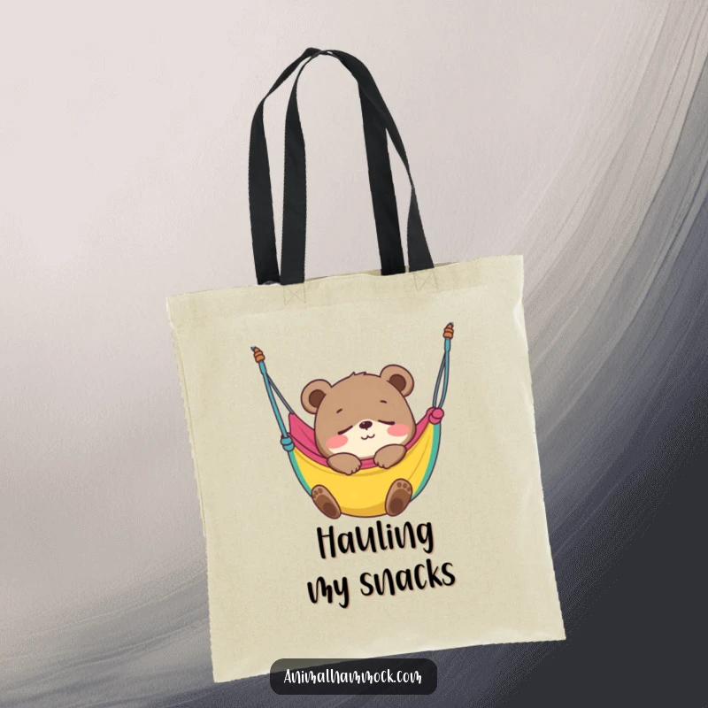 Funny Bear Cub Tote Bag depicting a smiling cub blissfully fast asleep in a colorful hammock, ideal for carrying essentials with humor.