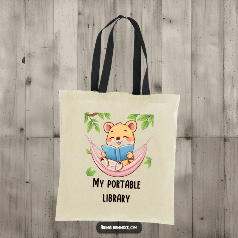 Funny tote bag featuring a happy animal reading a book in a hammock, perfect for carrying your literary treasures with a humorous touch.